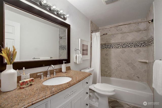 full bathroom featuring toilet, vanity, and shower / bath combo