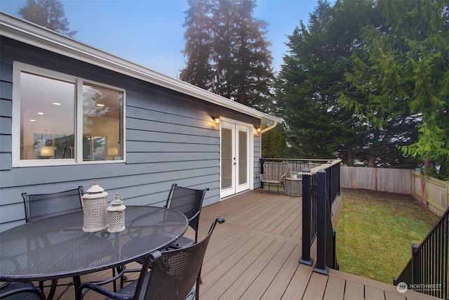 wooden terrace with a yard