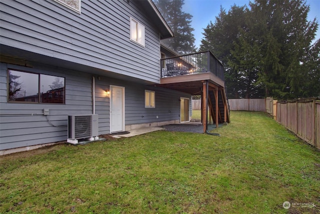 view of yard with a deck and cooling unit