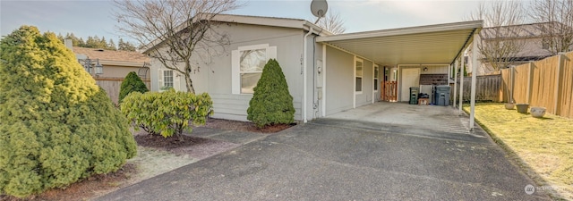 view of front of property featuring a carport