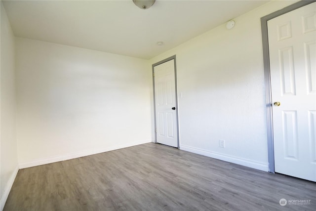 17333 33rd Ave S, Seatac, WA 98188 - unfurnished bedroom featuring wood-type flooring