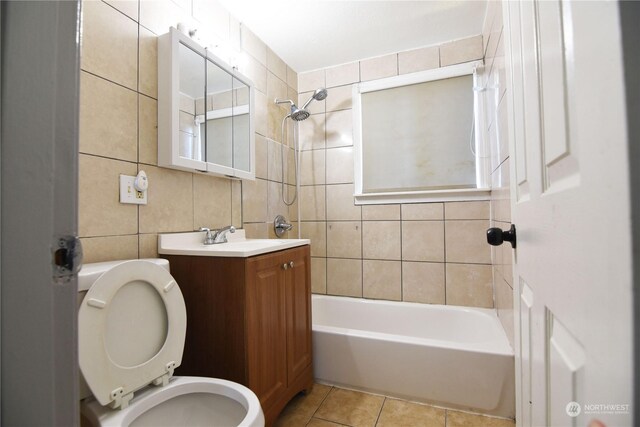 17333 33rd Ave S, Seatac, WA 98188 - full bathroom featuring tile walls, toilet, tile patterned floors, vanity, and tiled shower / bath combo