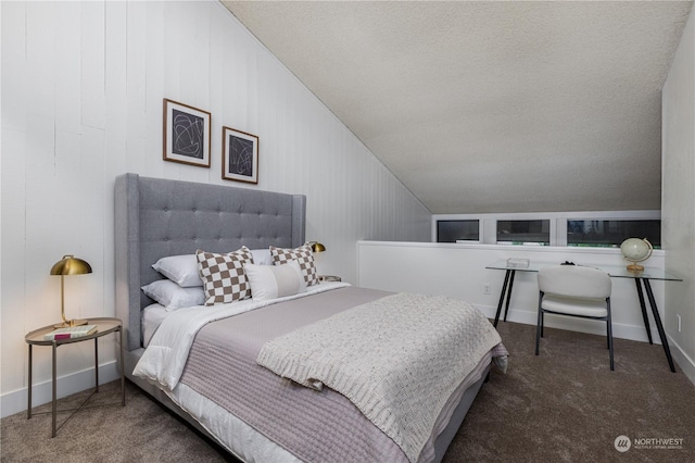 bedroom with vaulted ceiling and carpet floors