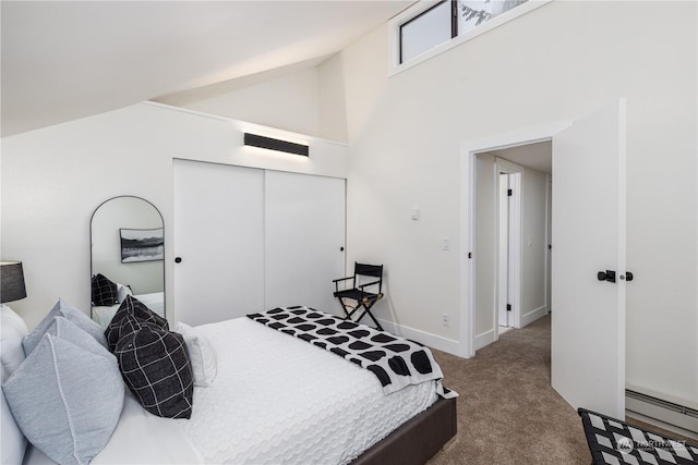 bedroom with a closet, carpet flooring, baseboard heating, and high vaulted ceiling