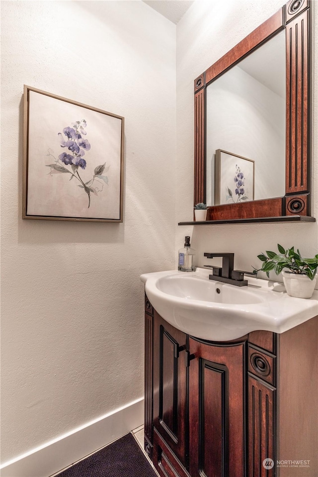 bathroom with vanity and tile patterned flooring