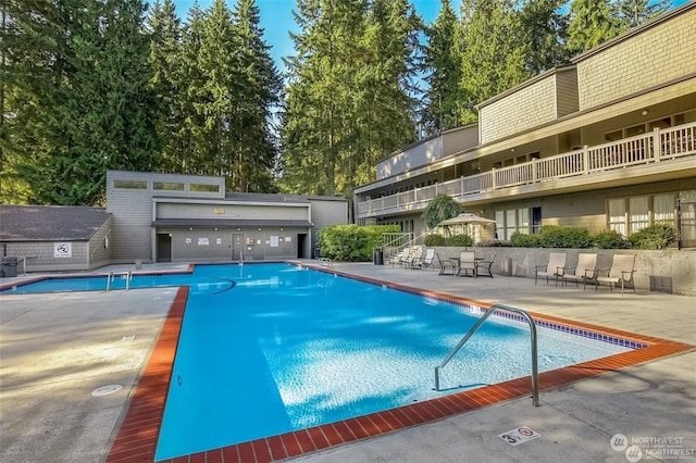 view of swimming pool featuring a patio area