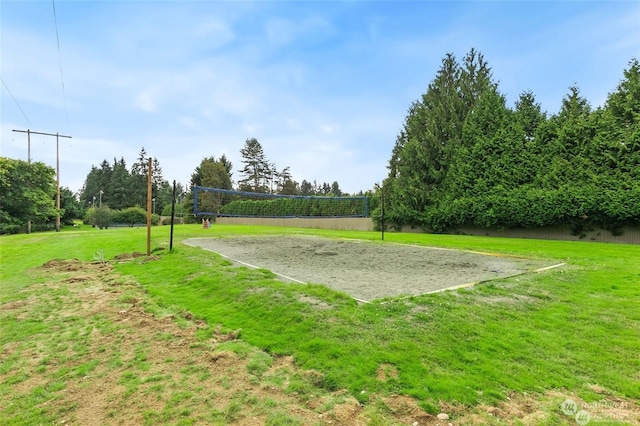 view of home's community with a lawn and volleyball court