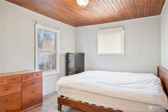 carpeted bedroom featuring wooden ceiling