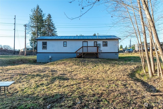 rear view of house with a lawn