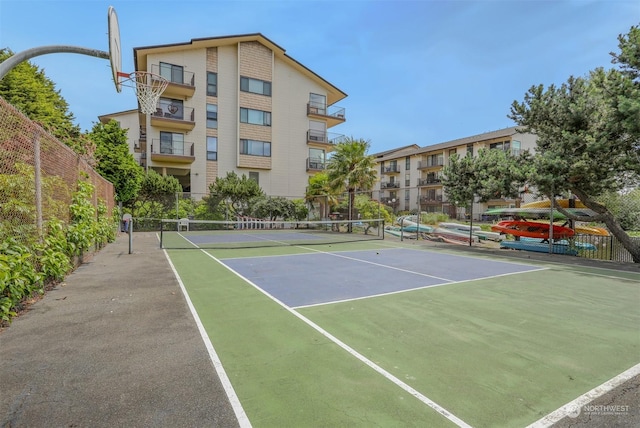 view of tennis court featuring basketball court