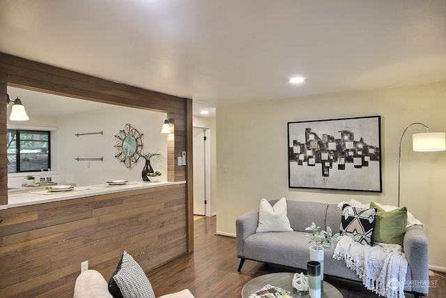 living room with dark hardwood / wood-style flooring