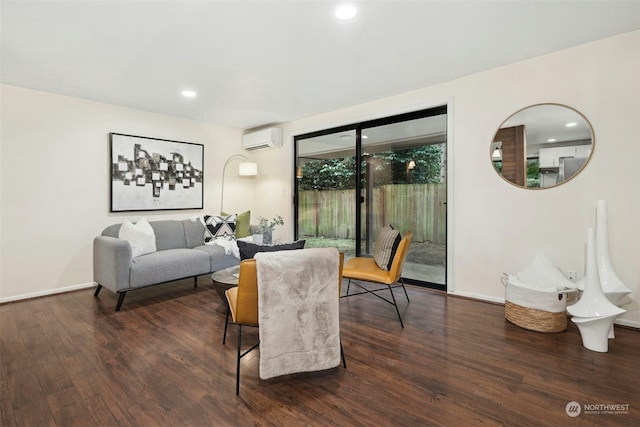 living room with dark hardwood / wood-style floors and a wall unit AC