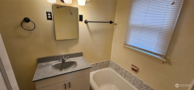 bathroom with a tub to relax in and vanity