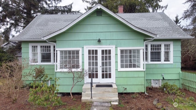 rear view of property featuring french doors