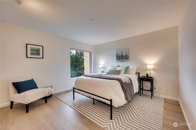 bedroom with light hardwood / wood-style floors