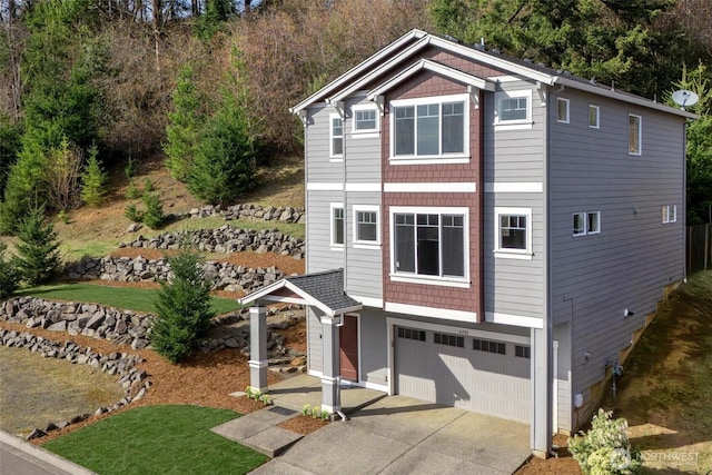 view of front of house with an attached garage and driveway