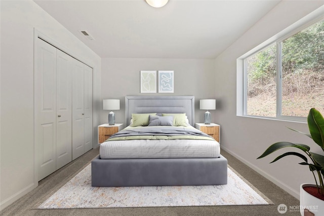 bedroom featuring a closet, visible vents, baseboards, and carpet floors