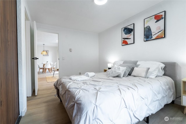 bedroom with light hardwood / wood-style flooring