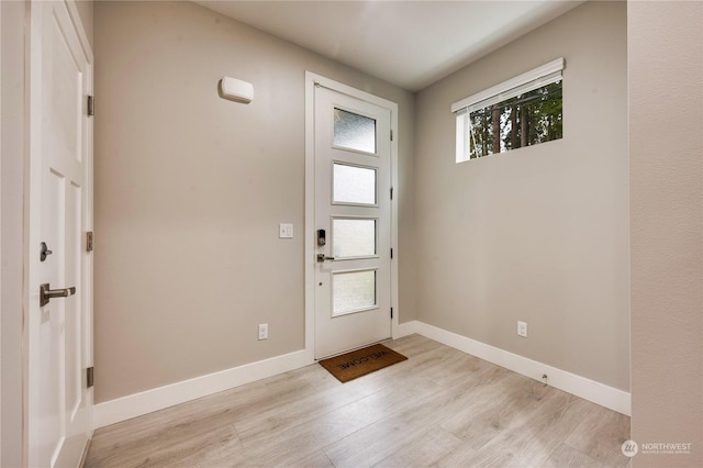 foyer with light wood-type flooring