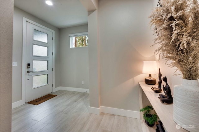 entryway with light hardwood / wood-style floors