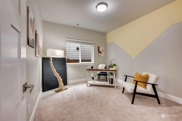 sitting room featuring carpet flooring