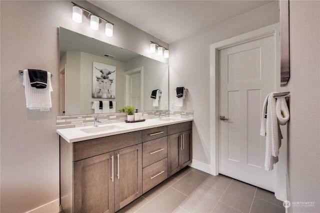 bathroom featuring tile patterned floors, tasteful backsplash, and vanity