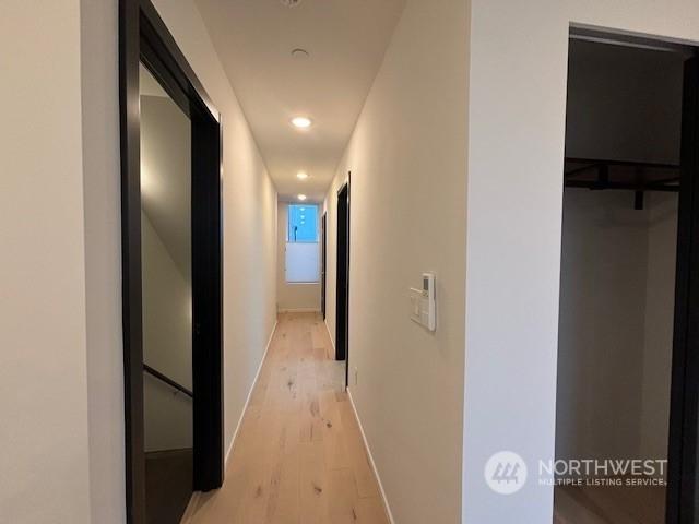 hallway featuring light hardwood / wood-style flooring