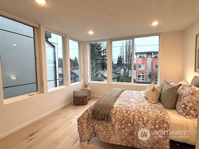 bedroom with wood-type flooring