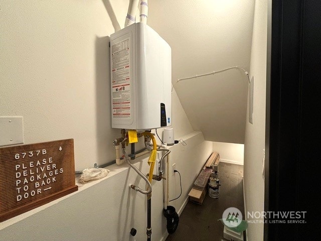 utility room featuring water heater