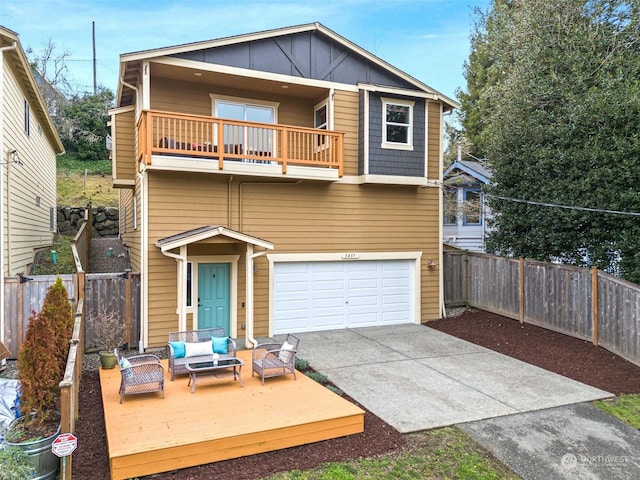 view of front facade featuring a garage, outdoor lounge area, and a balcony