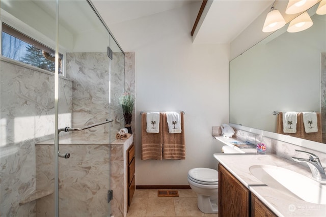 bathroom with walk in shower, vanity, toilet, and tile patterned flooring