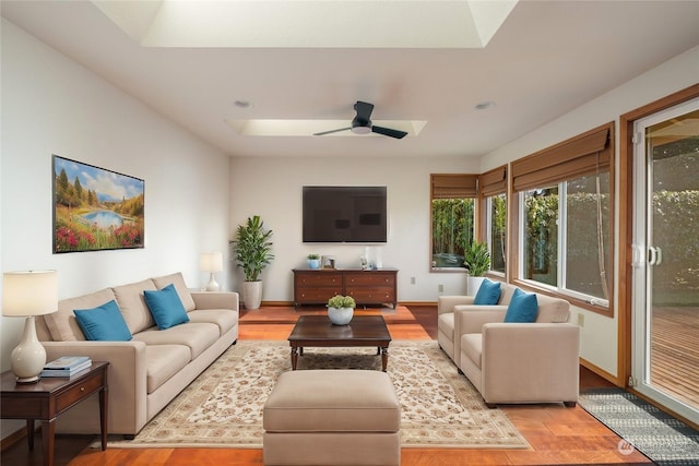 living room featuring ceiling fan and light wood-type flooring