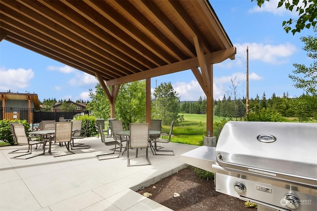 view of patio featuring a grill