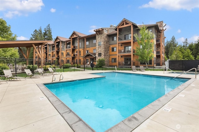 view of pool featuring a patio