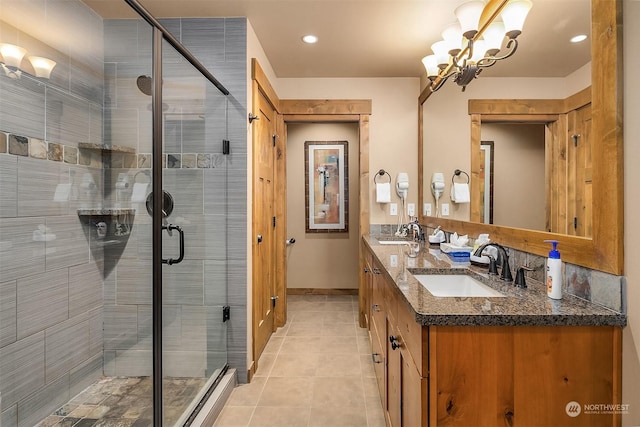 bathroom featuring tile patterned flooring, vanity, and an enclosed shower