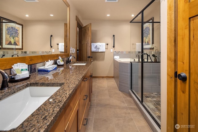 bathroom with tile patterned floors, plus walk in shower, and vanity