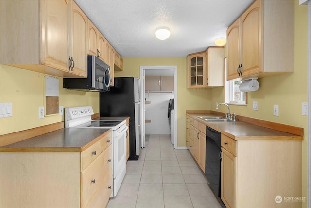 kitchen with light tile patterned floors, light brown cabinets, white electric range, dishwasher, and sink