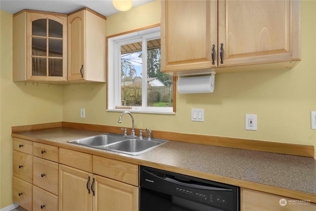 kitchen featuring black dishwasher, light brown cabinets, and sink