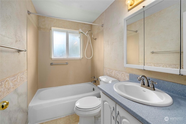 full bathroom featuring toilet, vanity, tile patterned flooring, and shower / bathing tub combination