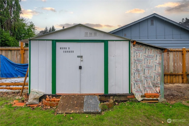 outdoor structure at dusk with a lawn