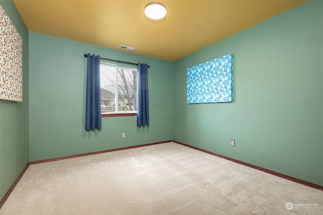 spare room featuring carpet flooring