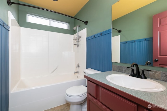 full bathroom with toilet, vanity, tile patterned floors, and washtub / shower combination