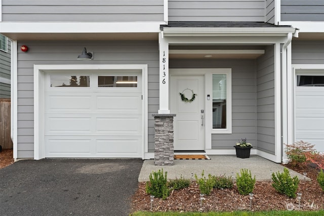 property entrance with a garage