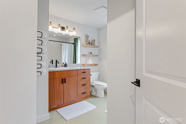 full bathroom with toilet, curtained shower, and vanity