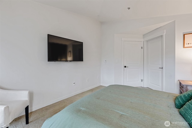 carpeted bedroom with baseboards