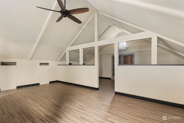 additional living space featuring hardwood / wood-style floors, ceiling fan, and vaulted ceiling