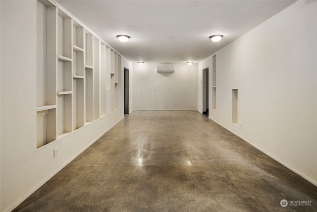 interior space featuring a wall mounted air conditioner and built in shelves