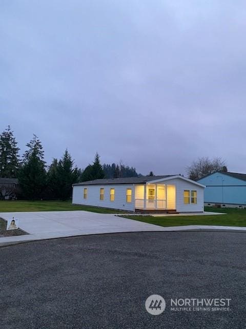 ranch-style home with a front yard