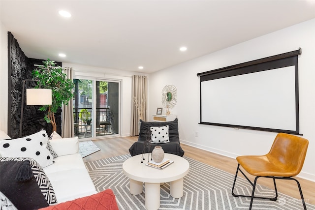 home theater room featuring light wood-type flooring