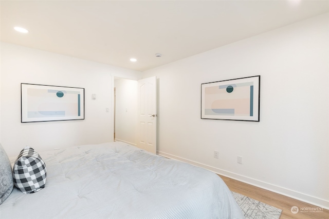 bedroom featuring wood-type flooring